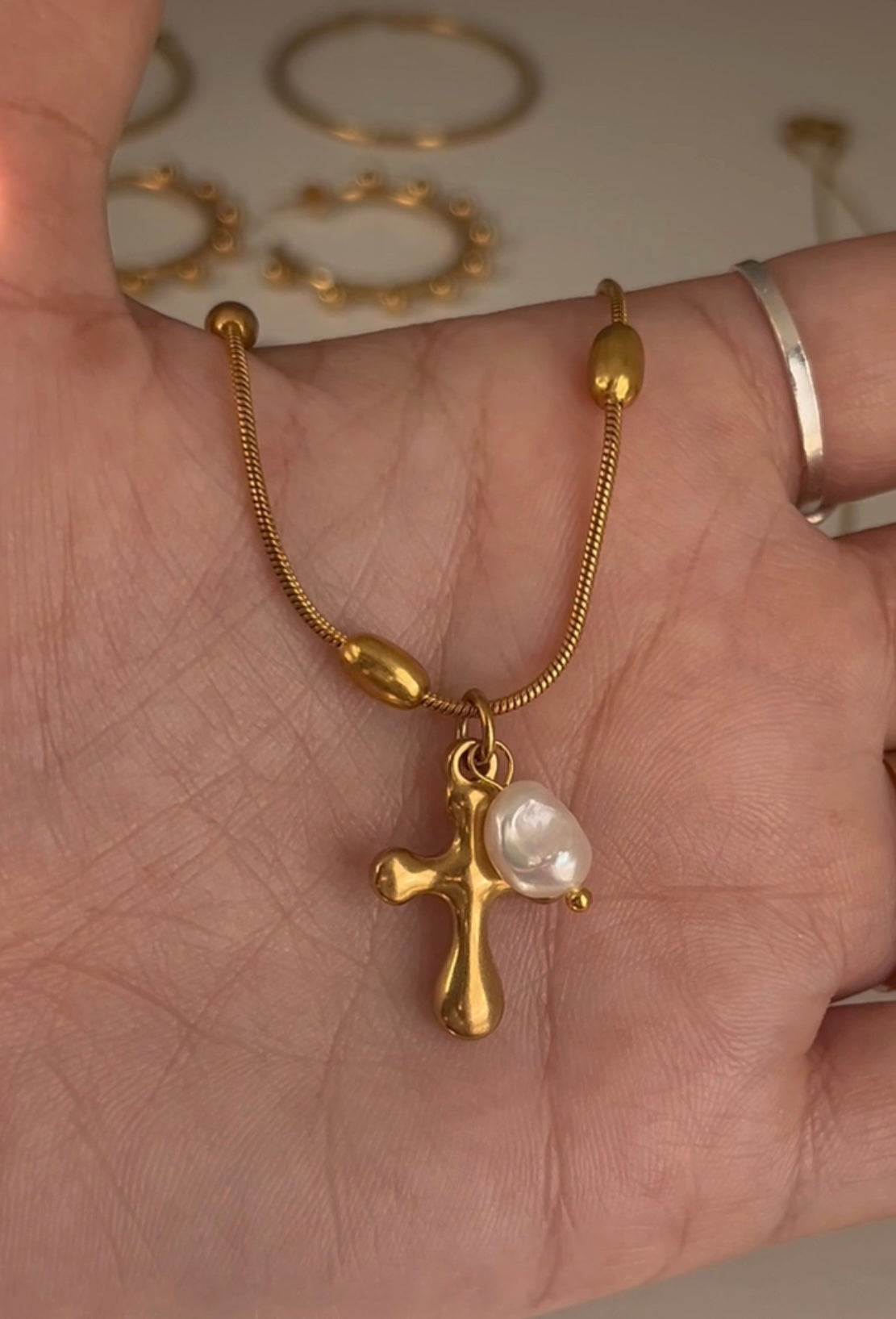 Cross and pearl necklace